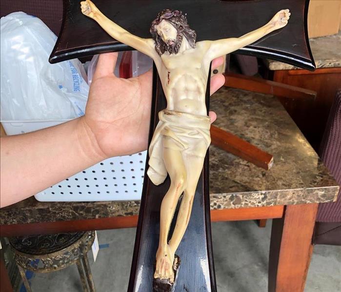 After photo of crucifix
