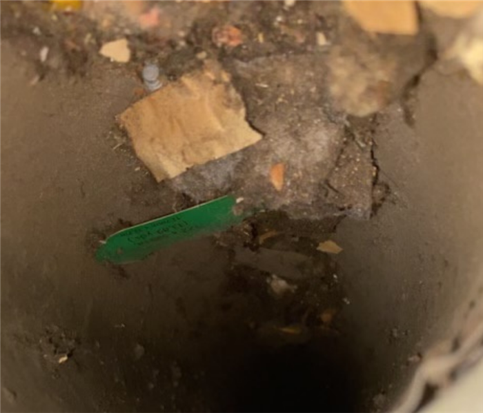 a duct with debris and dirt